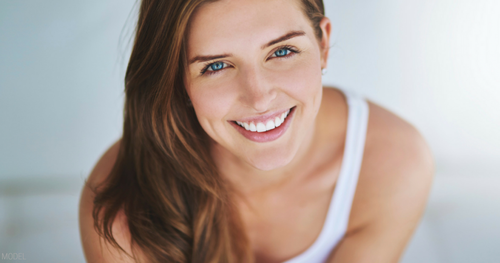 Smiling dark haired woman's face