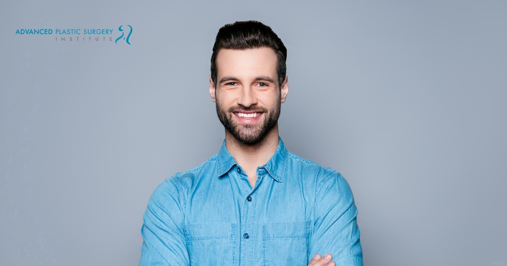 Smiling man wearing a blue shirt (MODEL)