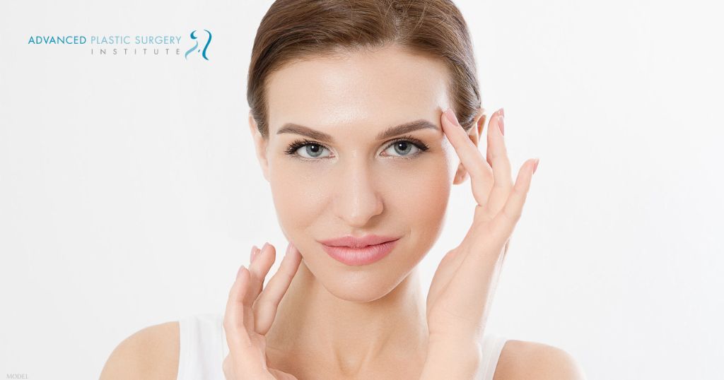 Beautiful woman touching her face (model)