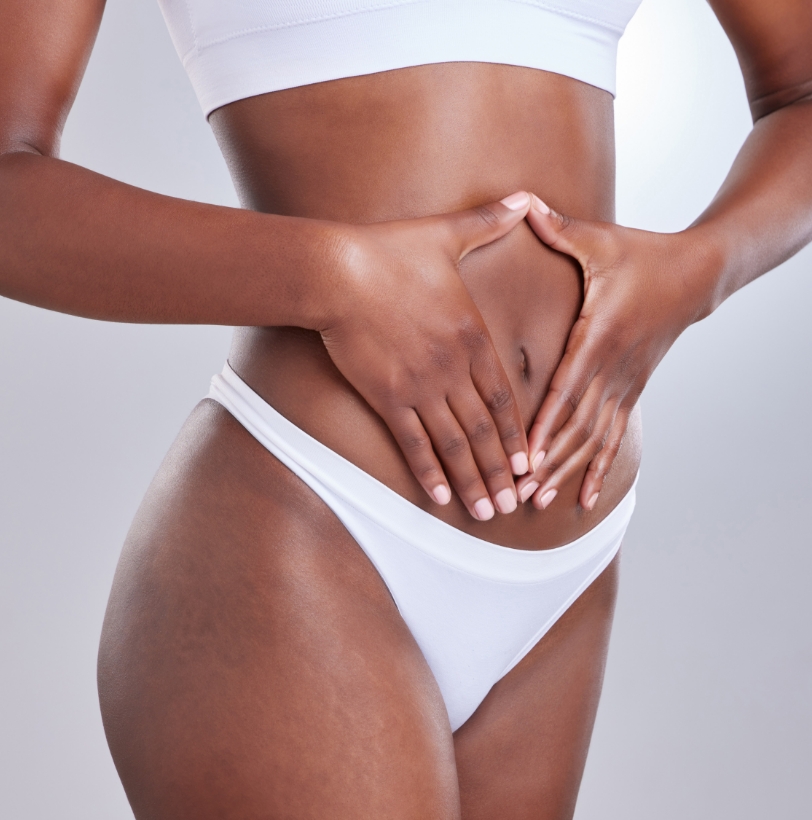Model displaying toned midsection and smooth skin, representing cosmetic body contouring results.