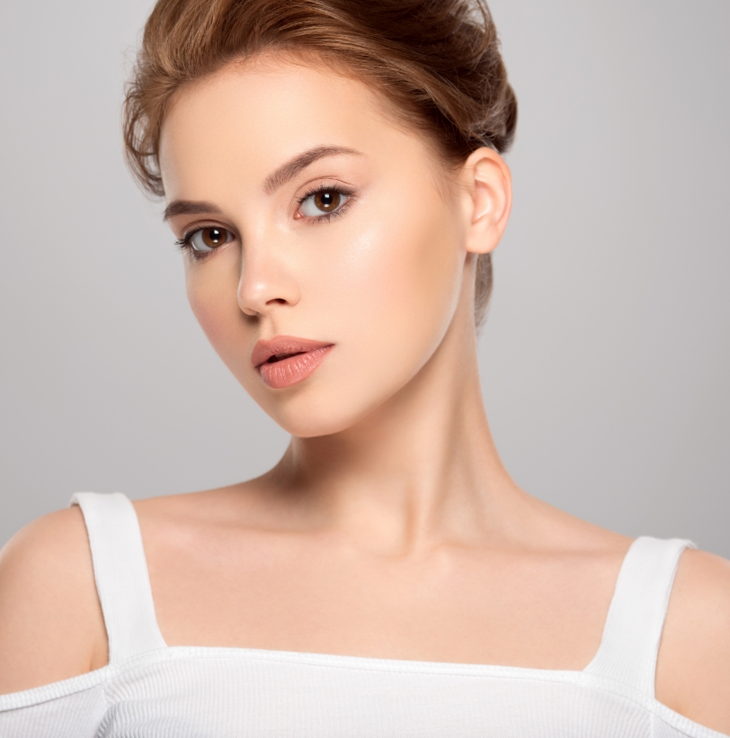Close-up of a woman’s face showing refreshed, natural-looking skin tone and texture.