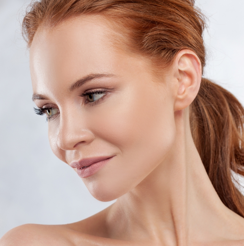 Close-up of a woman’s face showing refreshed, natural-looking skin tone and texture.