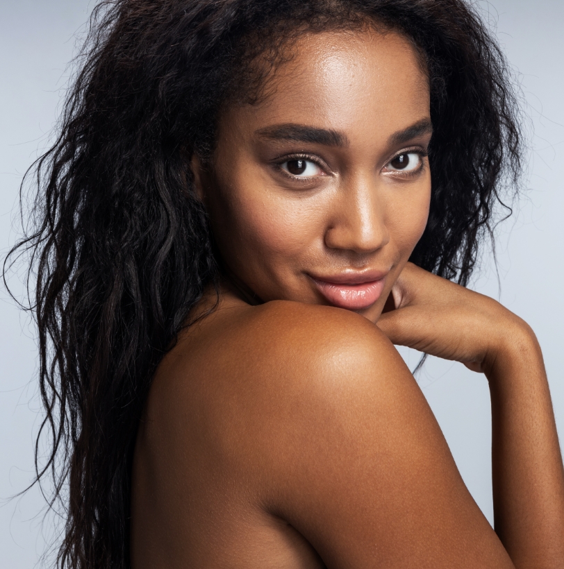 Close-up of a woman’s face showing refreshed, natural-looking skin tone and texture.