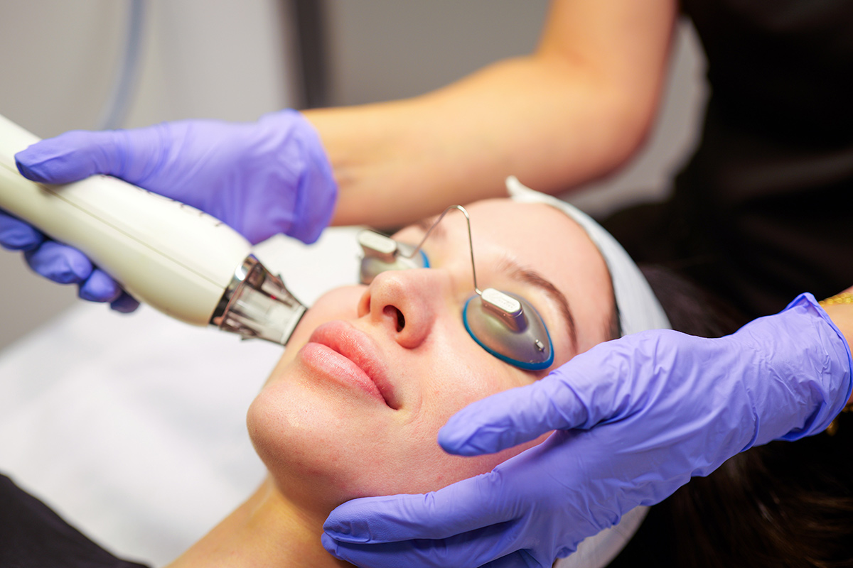 Advanced Plastic Surgery Institute professional performing a facial treatment